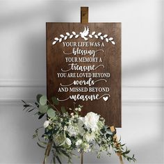 a wooden sign that says your life was a blessing you memory, trust, you are loved beyond and missed beyond