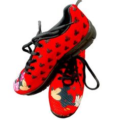 A Must Have For All Disney And Mickey Minnie Fans! Red Cloth Sneakers With Black Rubber Soles Feature Mickey And Minnie Stealing A Kiss On Each Shoe. Wear To The Theme Parks Or Everyday To Show Your Love For Our Favorite Mouse! Brand New Without Box! Never Worn Or Used. Comfortable Red Sneakers With Round Toe, Comfortable Red Round Toe Sneakers, Casual Mickey Mouse Lace-up Sneakers, Comfortable Red Low-top Running Shoes, Synthetic Running Shoes With Red Sole And Round Toe, Comfortable Sneakers With Red Sole And Round Toe, Fun Synthetic Sneakers For Sports, Disney Low-top Sneakers With Rubber Sole, Casual Red Non-slip Running Shoes