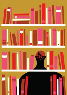 a man with glasses standing in front of a bookshelf filled with red and pink books