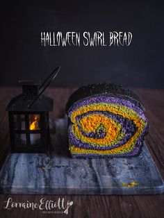 there is a cake that has been made to look like a spiral bread with the words halloween swirl bread on it