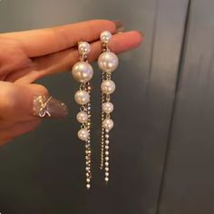 These Elegant And Sophisticated Big Gold Filled Simulation Pearl Long Drop Earrings. Style Them For Daytime, Wear Them At Night Or Dress Them Up For A Fancy Affair. Material : 100% 925 Sterling Silver + White Simulated-Pearl Measurements : Studs Measure 6.5 C (8.50 Cm Long For Diamonds And Small Pearls Chains) Shape: Long Drop Earrings Weight: 0.33 Oz Most Merchandise Ships Within 2 Days All Items Come Packaged In A Small Jewelry Box Which Is For When Buying As A Gift. White Pearl Earrings For Party, Chic White Pearl Earrings For Parties, Pearl White Dangle Earrings For Party, White Pearl Dangle Earrings For Evening, White Dangle Pearl Earrings For Evening, White Pearl Drop Earrings For Party, White Dangle Pearl Earrings For Party, Pearls Chains, Small Jewelry Box