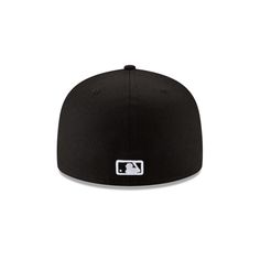 the new era fitted hat in black with white logo on the front and side panel