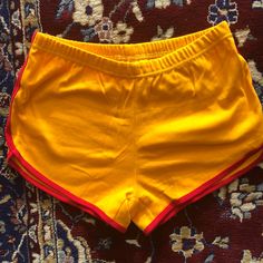 Never Worn Vintage Looking Short Shorts. Deep Yellow And Red. 100% Cotton. Stretch Cotton Yellow Shorts, Cheap Yellow Shorts For Playwear, Yellow Stretch Cotton Shorts, Yellow Retro Short Bottoms, Retro Yellow Short Bottoms, Yellow Cotton Shorts, Moisture-wicking Yellow Shorts, Casual Yellow Moisture-wicking Shorts, Deep Yellow