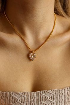 PRODUCT DESCRIPTION Embrace the timeless beauty of our Shining Heart Necklace, a meticulously crafted piece that captures the essence of love and luxury. The high-quality zircon pendant adds a touch of brilliance to your neckline, making this necklace a symbol of enduring elegance. Gold Statement Necklace Water Resistant 18k Gold-plated on High Quality Brass Length: 44cm plus 5cm adjustable chain AAA Grade Zircon Read our full Jewellery Care Guide here Read our Sizing Guide here Gold Heart-shaped Jewelry With Sparkling Stones, Luxury Heart Pendant Necklace For Wedding, Heart-shaped Gold Jewelry With Sparkling Stones, Cubic Zirconia Heart Pendant Clavicle Chain, Wedding Diamond Clavicle Chain Charm Necklace, Wedding Charm Necklace With Diamond, Gold Crystal Heart Pendant Necklace, Gold Crystal Heart Pendant Jewelry, Elegant Diamond Heart Pendant Charm Necklaces