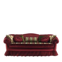 a red couch with two pillows on it