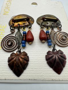 "These are still on the original card and are unsigned on the backs. These measure approx. 2\" in length." Vintage Dangle Earrings With Artistic Design, Original Card, Shell Earrings, Vintage Copper, Pierced Earrings, Earings Piercings, Jewelry Earrings Dangle, Swirl, Mixed Media