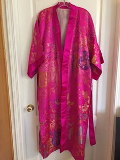 VINTAGE JAPANESE SILK/Satin Kimono - Made In Japan -Measures: length: 51", chest: 46.5", sleeve: 13.5" -Custom made, preowned in very good condition. Nice flowing relaxed style kimono. -Lined, includes a sash. bonus, has been loosely hemmed and can be let down I ONLY SHIP TO CANADA AND THE LOWER 48 STATES Long Pink Silk Robe, Pink Silk Kimono For Wedding, Pink Silk Wedding Kimono, Long Vintage Kimono For Festivals, Pink Vintage Long Kimono, Vintage Silk Kimono For Wedding, Traditional Pink Silk Kimono, Long Pink Festive Kimono, Silk Kimono For Wedding And Festive Occasions