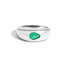 The Bombe Dome Ring with Pear Emerald transforms the classic bombe ring into a modern statement piece. This band features a natural pear shaped emerald burnish set at the center of a domed ring. The perfect addition to any stack seeking a bold addition. Teardrop Emerald Ring In Fine Jewelry Style, Fine Jewelry Emerald Teardrop Ring, Emerald Teardrop Ring Fine Jewelry, Classic Teardrop Emerald Ring For Formal Occasions, Teardrop Emerald Promise Ring In Fine Jewelry Style, Teardrop Emerald Ring For Formal Occasions, Classic Green Teardrop Emerald Ring, Modern Pear-shaped Gemstone Ring, Classic Pear-shaped Emerald Ring