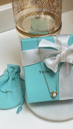 Authentic Tiffany & Co. Necklace 16 in” Knot Hoop Twist Circle Pearl 18K Yellow Gold It’s in excellent pre-loved condition, absolutely stunning beautiful pearl in the center of a gold twisted pendant I’ll be happy to include a Tiffany blue box, travel pouch and white satin bow Happy buy, all sales are final friends! ✨💋 Tiffany&co Necklace, Tiffany And Co Blue Necklace, Tiffany & Co, Tiffany Blue Box, Tiffany And Co Jewelry, Tiffany Necklace, Blue Box, Tiffany And Co, Satin Bow