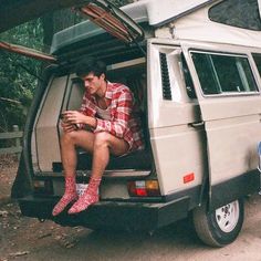 a man sitting in the back of a van