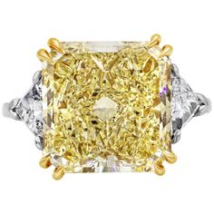 A wonderful engagement ring, showcasing a vibrant 10.59 carats radiant cut diamond certified by GIA as Fancy Yellow color and VS1 clarity, set on an eight prong 18K yellow gold basket. Accented with trillion cut diamonds on each side weighing 1.16 carats total, set on polished platinum. Size 6 US, resizable upon request.  Roman Malakov is a custom house, specializing in creating anything you can imagine. If you would like to receive a special quote on a custom piece, please message or call us. Radiant Diamond Engagement Rings, Estate Jewelry Rings, Trillion Diamonds, Contemporary Engagement Rings, Three Stone Diamond Ring, Platinum Diamond Engagement Rings, Fancy Yellow Diamond, Platinum Diamond Rings, Three Stone Diamond