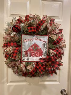 a christmas wreath hanging on the front door