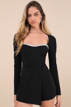 You'll make any night instantly more chic with a look like the Lulus Fashionable Sparkle Black Rhinestone Long Sleeve Skort Romper! Stretchy crepe knit shapes this skort romper with long sleeves that frame a princess-seamed bodice with a subtle sweetheart neckline, trimmed with sparkling rhinestones. High, fitted waist sits atop hidden shorts that boast a cute skirt overlay. Hidden back zipper/clasp. Fit: This garment fits true to size. Length: Above mid-thigh. Size medium measures 31" from shoulder to hem. Inseam: 2.75 Front Rise: 13.50 Bust: Great for any cup size. Waist: Fitted - very fitted at natural waist. Hip: Loosely Fitted. Undergarments: May be worn with a strapless bra, adhesive bra, petals, or no bra. Fabric: Fabric is very stretchy. Bodice and skirt are lined. Shell: 95% Polye Elegant Mini Length Party Jumpsuits And Rompers, Elegant Mini Length Jumpsuits And Rompers For Party, Elegant Mini-length Party Jumpsuits And Rompers, Elegant Mini Length Jumpsuit For Party, Elegant Mini Jumpsuits And Rompers For Night Out, Elegant Mini Jumpsuits And Rompers For Date Night, Elegant Mini Length Jumpsuits For Night Out, Elegant Mini Length Jumpsuits And Rompers For Date Night, Elegant Mini-length Jumpsuits And Rompers For Night Out