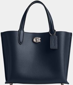 From COACH&#x2C; the Willow 24 Pebbled Leather Tote Bag features:Polished pebble leatherTurn-lock and magnetic snap closuresCenter zip compartmentDouble handlesDetachable strap for shoulder or crossbody wearFour protective feet at baseApprox. 9.5" L x 7.75" H x 4.25" W bag; 4.5" handle drop; 21.5" strap dropImported. Coach Willow, Tote Bag Coach, Polished Pebble, Dillard's, Global Fashion, Leather Tote Bag, Dark Navy, Sling Bag, Handbag Accessories