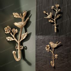 two decorative wall sconces with flowers and birds on them, one gold and the other silver