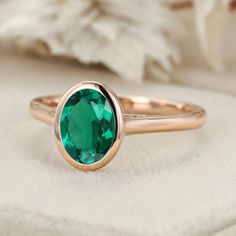 Discover timeless elegance with our Classic Solitaire 8x6mm Oval Cut Bezel Emerald Ring for Women in 14K Rose Gold, a symbol of style and sophistication. Formal Oval Emerald Ring In Rose Gold, Formal Rose Gold Oval Emerald Ring, Rose Gold Oval Emerald Ring, Rose Gold Oval Emerald Ring For Anniversary, Oval Emerald Ring In Rose Gold, Rose Gold Oval Ring For May Birthstone, Bezel Ring, May Birthstone, Affordable Jewelry