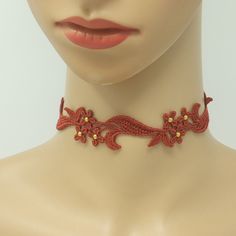 Experience luxury and enchantment with the Sophia Rust-Orange Floral Choker adorned with shimmering gold beads, adding a touch of sensuality and femininity - ideal for completing your look. The intricate 1/2 inch wide floral lace is made with my embroidery machine, using rayon thread, resulting in a delicate lace that is soft to the touch, flexible, and comfortable to wear. Rock this rust-orange lace choker day or night to level up your look, no matter how chill or dressed up you feel. Size adju Elegant Handmade Summer Choker, Elegant Orange Jewelry For Spring, Elegant Orange Spring Jewelry, Elegant Embellished Summer Jewelry, Elegant Orange Necklace For Party, Red Beaded Choker For Party, Elegant Beaded Choker For Summer, Elegant Embroidered Festival Jewelry, Elegant Embroidered Jewelry For Festival