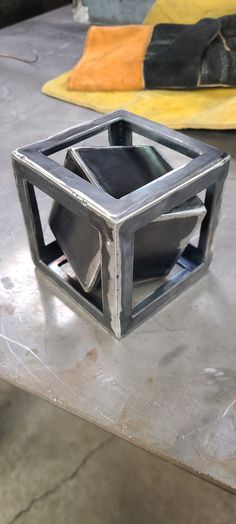 This is an extremely fun DIY welding kit that includes parts for a 3 inch cube, a 4 inch cube, 3 inches of 1/4" rod and 4 legs cut 3/4" long. The builder will have to make the 3 inch cube fit inside the 4 inch cube and use the rod to balance it perfect then weld up so it Spins inside. Great for MIG or TIG welders. Parts are raw and need to be cleaned up. Includes all parts necessary to build. Cut the 1/4" rod in half and tack on opposite corners. balance it perfect and then weld in place. measure and sharpen the ends of rods and make your lengths and balance spot on.  Requires a, Welder  Grinder  Pad sanders and cut off wheel.  Square and level. Welding Jig, Metal Welding Art, Tig Welder, Diy Welding, Tig Welding, Welding Art, Welding Projects, Fun Projects, Fun Diys