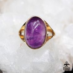 Metal: 9k Yellow Gold Weight: 4.56 grams Size: 5.5 US Stones: Amethyst *Make a statement with this eye-catching cocktail ring, showcasing a stunning Amethyst gemstone set in a lovely 9k yellow gold setting. Despite its vintage charm, this piece is in excellent condition with minimal wear or patina. Don't pass up the opportunity to add this timeless beauty to your collection! *P L E A S E * S E E * P H O T O S !! Yellow Gold Amethyst Cabochon Ring, Formal Spiritual Amethyst Ring, Formal Purple Amethyst Spiritual Ring, Formal Spiritual Purple Amethyst Ring, Collectible Amethyst Gemstone Rings, Fine Amethyst Ring For Collectors, Collectible Yellow Gold Amethyst Ring, Modern Cocktail, Tacoma Wa