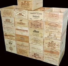 several boxes stacked on top of each other with different types of wine labels in them