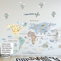 a child's room with a map wall sticker on the wall and toys