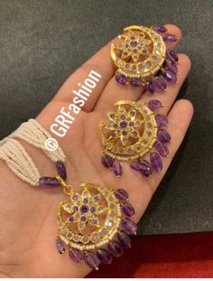 Beautiful traditional gold plated Hyderabadi Polki semi precious stone Jadau set with earrings. Perfect for wedding and parties. Feel free to msg me Please like and check my Facebook page for everyday jewelry updates and join my group too www.facebook.com/GRFashion1 https://www.facebook.com/groups/716870102034581/?ref=share Kundan Gemstone Necklace For Diwali, Eid Jewelry Sets With Latkans And Chandbali Shape, Eid Jewelry Sets With Chandbali Latkans, Gift Chandbali Tikka With Hand Set, Ceremonial Chandbali Gemstone Jewelry, Chandbali Tikka Gift, Chandbali Tikka As A Gift, 22k Gold Chandbali Jewelry With Cutdana, Gold Plated Chandbali Temple Jewelry Sets