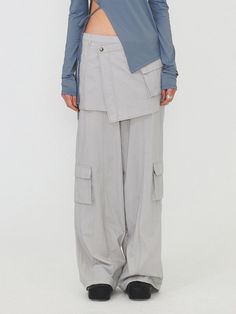 This is a modern and casual cargo pants by DIAGONAL that is made out of high quality and sturdy fabric. With unique design detail and trendy mood, you can style it for your clean and casual daily outfit.- Detachable skirt layered- Cargo pockets detail- Logo string on the hem- Logo snaps and YKK zipper Modern Spring Cargo Pants With Cargo Pockets, Gray Cargo Style Parachute Pants For Spring, Modern Spring Cargo Pants With Pockets, Gray Utility Cargo Pants For Spring, Gray Spring Cargo Pants With Multiple Pockets, Spring Gray Utility Cargo Pants, Gray Cargo Bottoms For Workwear, Detachable Skirt, Casual Cargo Pants