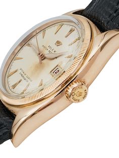 Men's Rolex 36mm Vintage 1950 Bubbleback Oyster Perpetual Rose Gold Watch with Cream Dial and Black Leather Strap. Pre-Owned SN# 714**** Year: 1950. Brand: Rolex. Gender: Men's. Condition: Good. Type: Wristwatch. Case Size: 36mm. Bezel Color: Gold. Dial Color: Cream. Bezel Type: Fluted. Model: Bubble-back. Indices: Non-Numeric. Model Number: 6075. Metal Type: Rose Gold. Model: Oyster Precision. Movement: Mechanical (Automatic). Band Material: Leather (Aftermarket). Buckle Material: Metal (Afterm Classic Formal Watch Accessories With Day-date Display, Classic Formal Watch With Day-date Display, Classic Formal Watches With Day-date Display, Vintage Watch With Day-date Display For Formal Occasions, Vintage Formal Watch With Day-date Display, Classic Yellow Gold Watch Accessories With Day-date Display, Classic Round Watch Accessories With Day-date Display, Classic Watch Accessories With Day-date Display, Men's Rolex