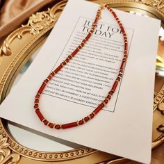 This Carnelian necklace, Beaded gemstone necklace, Red agate necklace, Red gemstone necklace, Healing jewelry, Energy stone necklace is classic and beautiful. It is made with 4mm carnelian round beads and 4×13mm carnelian tube beads with 18k gold (vacuum-plated on stainless steel) spacer beads.  Carnelian, with its warm, reddish hues, is a semi-precious stone prized for its beauty and historical significance. Used in ancient times for seals and amulets, it's believed to provide courage and vital Elegant Red Long Beaded Necklace, Elegant Long Red Beaded Necklace, Red Agate Beaded Necklaces With Round Beads, Red Carnelian Round Bead Jewelry, Red Agate Beaded Necklace With Gemstone Beads, Elegant Red Beaded Necklaces With Natural Stones, Elegant Red Beaded Necklace With Natural Stones, Agate Beaded Chain Necklace With Round Beads, Red Carnelian Single Strand Necklace