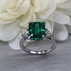 May Birthstone Ring, Emerald Cut Emerald Engagement Ring, Moissanite Ring, Three Stone Ring, Large Cocktail Ring, 14k White Gold Ring, 6722 #EmeraldRing #infinityjewelersusa #WeddingRing #BirthdayGift #EngagementRing #AnniversaryGift #CocktailRing #EmeraldCutEmerald #ThreeStoneRing #MoissaniteRing Pink Sapphire Earrings, Engagement Ring Moissanite, May Birthstone Rings, Ring Three Stone, Ring Emerald Cut, Emerald Cut Engagement, Cushion Cut Ring, Emerald Engagement Ring Cut, Three Stone Ring