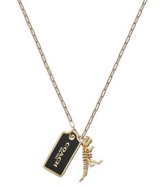 From COACH&#x2C; this necklace features: Pendant necklaceBrass/Enamel/Glass CrystalAdorned with iconic logo and signature Rexy dino mascotLobster clasp closureApprox. 22" length Includes COACH pouchImported. Black Jewelry With Logo Charm For Gift, Black Metal Jewelry With Logo Charm, Personalized Black Enamel Jewelry, Coach Dinosaur, Coach Necklace, C Necklace, 20 Birthday, Dope Jewelry Accessories, Dinosaur Necklace