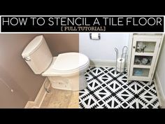 a bathroom with black and white tiles on the floor, and a toilet in the corner