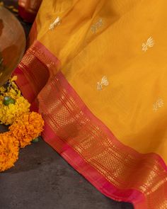 "Experience the vibrant beauty of our Handwoven Narali Kath yellow pure silk yeola paithani. Handcrafted with traditional weaving techniques, each piece is a unique work of art. Add a touch of elegance and tradition to your wardrobe (without breaking the bank!). No two are alike. Limited edition!" Transitional Yellow Katan Silk Dupatta, Yellow Katan Silk Dupatta For Transitional Season, Cotton Silk Traditional Wear For Navratri Rituals, Traditional Yellow Banarasi Silk Saree, Yellow Banarasi Silk Traditional Saree, Transitional Traditional Wear With Zari Work In Yellow, Transitional Cotton Silk Traditional Wear For Rituals, Gold Cotton Silk Saree With Traditional Patterns, Transitional Season Gold Paithani Silk Traditional Wear