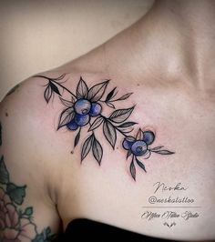 a woman's chest with blue flowers on it