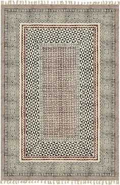 a square rug with an intricate design on the front and back side, in black and white