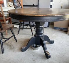 an old fashioned table and chairs in a room