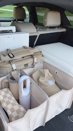 an open trunk in the back of a car filled with luggage