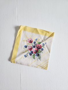 This vintage handkerchief is a darling addition to any collection. The hanky features a pattern of flowers. It measures 11.25" x 10.75". This piece is in good vintage condition with some wear and age. There are a few holes (see last four photos). Feel free to send me any questions! Vintage Cotton Handkerchiefs For Spring, Vintage Flower Shaped Handkerchiefs For Spring, Vintage Flower-shaped Handkerchiefs For Spring, Vintage Flower Handkerchiefs For Spring, Spring Vintage Flower Shaped Handkerchiefs, Vintage Cotton Handkerchiefs With Floral Print, Vintage Floral Print Cotton Handkerchiefs, Vintage White Handkerchiefs For Spring, Vintage White Floral Print Handkerchiefs