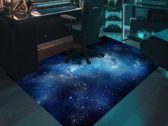 a computer desk and chair in a room with stars on the floor next to it