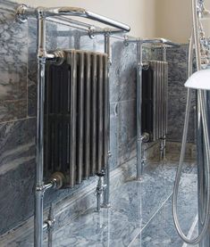 a bath room with a shower and a radiator