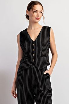 Pinstriped sleeveless vest top featuring a functional button down front, faux side pockets for detail, an adjustable cinch detail in the back and is lined. Styled with our Whitney pants. Available in black and navy. Model is 5'9" and is wearing a small. Fit chart in photos Fabric Contents: 92% Polyester, 5% Rayon, 2% Spandex Pinstripe Vest, Curvy Girl Dress, Trousers Details, Curvy Dress, Sleeveless Vest, Matching Dresses, Vest Top, Cardigan Jacket, Polished Look