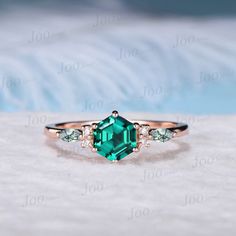 ABOUT THIS RING : The emerald gemstone ring is A GOOD LUCK GEMSTONE, emerald can bring you immense luck and fortunes, even when you lose hope. It is closely associated with the planet of Mercury. So, when life throws challenges in your way, you can overcome every obstacle by carrying or wearing emerald. PERFECT FOR GIFTING: This dainty green emerald ring come in a delicate jewelry box, represents the birthstone of May and the official gem of the 55th anniversary, best gift option for special som Emerald Jewelry With Accent Stones For Proposal, Green Emerald Solitaire Crystal Ring, Green Emerald Rings With Accent Stones, Emerald Ring For Proposal In Fine Jewelry Style, Diamond Ring With Accent Stones For Proposal, Fine Emerald Ring For Proposal, Green Round Cut Jewelry For Proposal, Green Emerald-cut Birthstone Ring For Anniversary, Green Emerald Cut Birthstone Ring For Anniversary