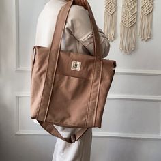 "Handmade cotton canvas tote bag with zipper that I specially designed for everyday use. Check out my tote bags for the very best in unique or custom, handmade from women's bags shop. If you want to see a different style, take a look at my collection ⬇ https://etsy.me/3fgNzR9 🎁 WHAT IS IN THE PACKAGE * 1 piece Large tote bag with zipper closure Usage: Shoulder Bag, HandBag and Crossbody Bag Gender: Unisex In summary; BODY *  Cotton Canvas. The fabric has stain-proof and water-repellent properti Beige Cotton Backpack Shoulder Bag, Beige Cotton Backpack Style Shoulder Bag, Cotton Beige Backpack Style Shoulder Bag, Cotton Shoulder Bag Backpack For Daily Use, Daily Use Cotton Shoulder Backpack, Beige Cotton Backpack, Cotton Canvas Backpack With Canvas Lining, Cotton Canvas Backpack With Pockets, Daily Use Canvas Bag With Zipper Closure