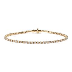 Turn heads with this stunning lab-grown diamond tennis bracelet. Set in warm 14-karat yellow gold  all the diamonds in this classic bracelet design are hand-matched for consistent color  clarity  and sparkle. A secure box clasp offers worry-free daily wear. Classic Gold Bracelet With Brilliant Cut, Classic Yellow Gold Tennis Bracelet With Single Cut Diamonds, Classic Yellow Gold Diamond Cut Tennis Bracelet, Classic Yellow Gold Tennis Bracelet With Diamond Accents, Classic Tennis Bracelet With Diamond Accents, Classic Gold Bracelet With Diamond White Prong Setting, Classic Gold Bracelet With Round Cut Cubic Zirconia, Classic Gold Bracelet With Prong Setting, Classic Round Diamond White Gold Bracelet