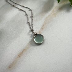 "Sterling Silver Rain Drop Necklace, Aesthetic Necklace Cottagecore Jewelry, Bohemian Necklace for Women Nature Jewelry Gift for Her Our Spring Rain Drop Necklace is made with sterling silver. The silver brightens this beautifully simple design. This Earthy Necklace is the perfect gift for a nature lover. They will love this simple Aesthetic Necklace and bright sterling glass pendant with a beautiful cottagecore jewelry. Handmade Art Glass Jewelry by Weathered Heather in Central NY! The dainty n Bohemian Charm Necklaces With Clavicle Chain, Bohemian Everyday Clavicle Chain Jewelry, Bohemian Clavicle Chain Jewelry For Everyday, Bohemian Clavicle Chain Charm Necklace, Everyday Bohemian Charm Necklace With Round Pendant, Wire Wrapped Round Pendant Necklace For Everyday, Everyday Wire Wrapped Round Pendant Necklace, Silver Wire Wrapped Necklaces For Everyday, Silver Wire Wrapped Necklace For Everyday