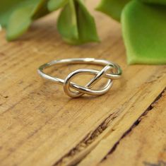 This Infinity Knot Ring is a dainty and classic ring. It's a great gift for that special someone. -14K Solid Gold -Infinity Knot Ring -Band just over 1mm thick This ring is a great gift for many occasions. It is dainty and delicate yet classic and sturdy. Each ring is handcrafted just for you and treated with care. This ring comes in your choice of Yellow Gold, White Gold, or Rose Gold (Pink Gold). Each ring comes packaged in a Ring Box ready for gift giving. It will be shipped via Priority Mail Modern Twist Infinity Stackable Rings As Gift, Classic Infinity Stackable Rings As Gift, Classic Infinity Rings As A Gift, Classic Infinity Rings As Gift, Classic Infinity Ring As A Gift, Classic Infinity Ring As Gift, Infinity Shape Stackable Fine Jewelry Rings As Gift, Fine Jewelry Infinity Stackable Rings As Gift, Fine Jewelry Stackable Infinity Rings As Gift