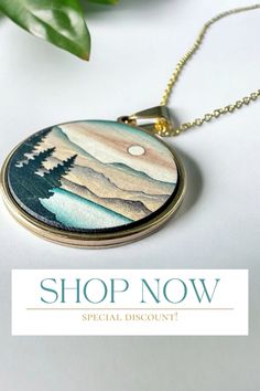 Each pendant is meticulously made from high-quality wood, showcasing the intricate details of a mountain landscape, and is paired with your choice of a gold or silver sun pendant to add a touch of elegance and warmth. The contrast between the natural wood and the lustrous metal creates a harmonious balance, making this necklace a versatile accessory for any occasion, whether it's a casual day out or a special evening event. #necklace #statementjewelry #pendantnecklacegold #jewelry #jewellerydesign Sun Pendant, Wooden Necklace, 5th Anniversary, Anniversary Gift For Her, Delicate Necklace, Dainty Jewelry, Gold Pendant Necklace, Mountain Landscape, Silver Pendant Necklace