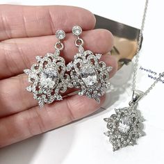 "A stunning Victorian wedding vintage style bridal jewelry set with cz earrings and necklace featuring intricate Fleur de Lis Damask royalty inspired motifs detailed dangles. They are lightweight and made of high quality clear cubic zirconia on sterling silver posts framed in white gold silver rhodium tarnish-resistant finish. Earrings are 1 3/8\" (3.5cm) including cz-studded sterling silver posts. Pendant is about 1 3/8\" (3.5cm) ???with bail. Chain length can be added with a 2\" extender chain Bridal Jewels, Vintage Style Necklace, Crystal Earrings Wedding, Pearl Jewelry Wedding, Victorian Wedding, Wedding Vintage, Vintage Style Wedding, Cz Jewelry, Cz Earrings