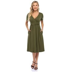 This dress features a V-neck design for a stylish and flattering look. Flattering Fitted V-neck Spring Dress, Fitted Flattering V-neck Spring Dress, Chic V-neck Solid Color Midi Dress, Flattering V-neck Wrap Dress For Summer, Flattering V-neck Summer Dresses, Chic Green V-neck Dress With Surplice Neckline, Flattering V-neck Dress For Date Night, Green Fitted Short Sleeve V-neck Dress, Casual Midi-length V-neck Dress For Date Night