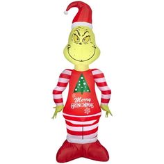 an inflatable christmas decoration with a grin face